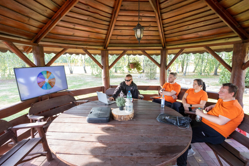 a group of people sitting around a table